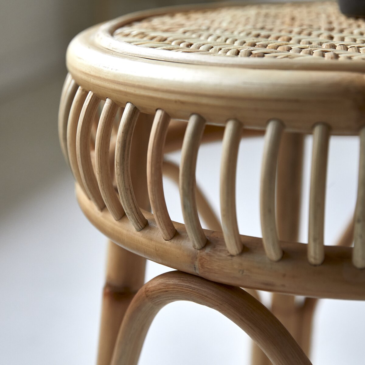 Round rattan store bedside table